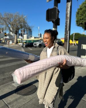 Tatyana Ali Instagram - Another successful day at @Ragfindersofca sourcing the perfect fabrics for Baby Yams! I’m so excited for this newest round of baby quilts coming soon to baby-yams.com! 

P.S. shoutout @natashapostrosow for my poncho. Girl I still got it!