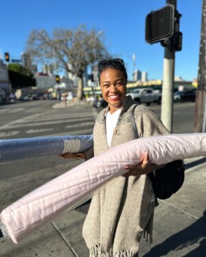 Tatyana Ali Instagram - Another successful day at @Ragfindersofca sourcing the perfect fabrics for Baby Yams! I’m so excited for this newest round of baby quilts coming soon to baby-yams.com! 

P.S. shoutout @natashapostrosow for my poncho. Girl I still got it!