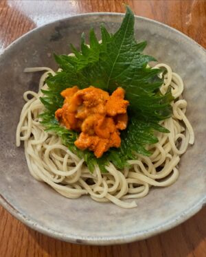 Aiste Miseviciute Instagram - Originally from Tokyo, soba master Katsuki Sakurai, the head chef of @yenparisfr, always wanted to live abroad. When the ready-to-wear company he was working for offered for him to move to Paris, he did not hesitate for a second.
To perfect the complex art of making soba, he spent a year working alongside one of the best masters in Japan, Takahashi Kunihiro, as an apprentice in Kyushu. He then moved to Paris, where he has been the head chef at restaurant Yen for over 20 years.
While the process for making soba might appear quite simple at first sight, it demands real technique and expertise. Water and buckwheat are the only ingredients used to make soba noodles; thus, their quality is essential. For his restaurant in Paris, Katsuki Sakurai imports buckwheat from Japan, before mixing it with water and cutting the soba every day.
The speed at which the noodles are cut is also a crucial factor. The best soba will never be too dry, will always be perfectly al dente, and will possess the beautiful flavour of buckwheat.

* The short article written by me was originally published by Pen magazine. @penmagazine @penofficial 
https://pen-online.com/travel/katsuki-sakurai-europes-best-soba-maker/ 

In the pictures:

- Cold soba with sea urchin
- Chutoro and sea bream sashimi
- Fried mochi with bottarga
- Zucchinni flower tempura (when in season)
- Otoro and sea urchin temaki
- Black cod
- Hot soba