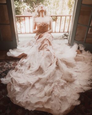 Alexandra Vino Instagram - Awaiting Summer…. Dripping in elegance by @annaguptaofficial wrapped in feathers, and lost in a dream ✨✨ Embracing the beauty of the moment, one step at a time. 📸 @theckm @aarongomezp styling…. #GoldenHourGlow#Elegance #LuxuryFashion #Glamour #DreamyVibes #GoldenHour #FeatherGown #HollywoodAesthetic #Graceful #TimelessBeauty #HighFashion
