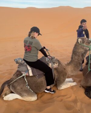 Ali Landry Monteverde Instagram - This entire time in Africa has been surreal but  riding camels out into the desert at sunset to camp under the stars overnight in the Sahara with friends from every corner of the globe will go down in the record books as top experiences of a lifetime! @sahara_serenity_tours #makingmovies 🐪 🏜️ 🔥 ✨ 🎥