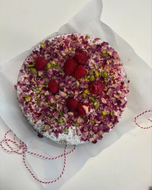 Annabel Crabb Instagram - Thank you to my awesome, smart, talented colleagues on our new project who already are a gift to work with but who bowled up this superb #workbirthday surprise today and look how beautiful it is. I could barely stand to eat it and then discovered that I really actually could. Cake is from @flourandstone … many pistachios and teeny tiny rosebuds came to great harm. ❤️ thanks team