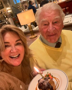 Anthea Turner Instagram - Happy 92nd Birthday Dad 🥳
You’re the bomb and we all love you ♥️
 @wendy_turner_webster came down with the ‘Lurgy’ so our trip the Greenwich Maritime Museum we will do on another day v soon. 
Not been there myself, since I played John Harrison in a Blue Peter film about Longitude wearing an itchy wig ! 🕰️ 😂

Last picture is one I gave Dad in a lovely frame. Mum had come filming with me, it was an about Britain holiday program and the subject was ‘rambling’ you can see here Mums idea of rambling clothes! 
I never saw her in Jeans, anything with a logo and even when she was ill always ‘front door ready’ with lipstick on should anyone pop in. ♥️♥️♥️
