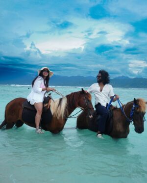 Bhavini Purohit Instagram - Golden hour, ocean breeze, and a ride into the sunset—just us, the waves, and our horses in paradise w/ @wonderfulindonesia 
.
{Travel ,trend,island,couple,couplevideos,gilliT,love,experiences,crazy}
.
#influencer #love #crazy #experience #bali #gilliislands  #trending #trend #love #balitrip #beach #beachlife #horse #horseriding