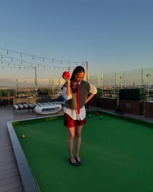 Charlotte Nicdao Instagram - Mythic Quest Season Four starts THIS WEDNESDAY. Please enjoy one serious photo of @danadelaney @claytonhawkins and @lucywarrenstyle ‘s good work, followed by a very silly lawn bowls photo shoot nobody asked for.