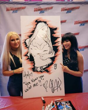 Jillian Faye Hall Instagram - “You know you want me,
You can’t take your eyes away from me,
I’m the hottest thing since sliced bread,”
🎶 Sliced Bread by @jillianhall1 ❤️

I love this song!! 

This pic is Jillian signing the ceiling tile art in 2017 at the @thewrestlingguystore. We had so much fun signing together! Miss you Jillo! #cookies&cream