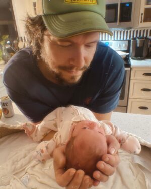 Jordan Danger Instagram - Get you a man who spends all day successfully repairing a generator before a hurricane and then cradles your newborn daughter like this. I love you so much, Dave 🥲