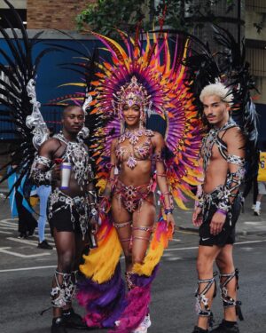 Jourdan Dunn Instagram - Carnival Chronicles 🩷🧡💛💜

Costume design @eccdesigner 
Band @ucomcarnival 
📸 @luceroglow