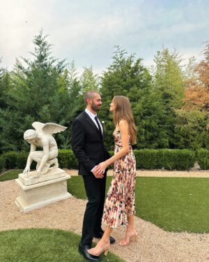 Lani Randol Instagram - This photo should not be considered any sort of proof that I do, indeed, step on Garrett’s toes as he so claims I often do, ruining many of his beloved shoes. 

It should, however, be considered a congratulatory post for my bro @maverickbaker & @thekenziebree who are officially Mr. & Mrs. Baker 💍🥂 We love you two dearly and so thrilled to have the Baker bunch complete 🖤 

Also… is this considered hard launching Garrett’s new look? 

#wedding #married #weddingguestdress #love
