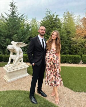 Lani Randol Instagram - This photo should not be considered any sort of proof that I do, indeed, step on Garrett’s toes as he so claims I often do, ruining many of his beloved shoes. 

It should, however, be considered a congratulatory post for my bro @maverickbaker & @thekenziebree who are officially Mr. & Mrs. Baker 💍🥂 We love you two dearly and so thrilled to have the Baker bunch complete 🖤 

Also… is this considered hard launching Garrett’s new look? 

#wedding #married #weddingguestdress #love