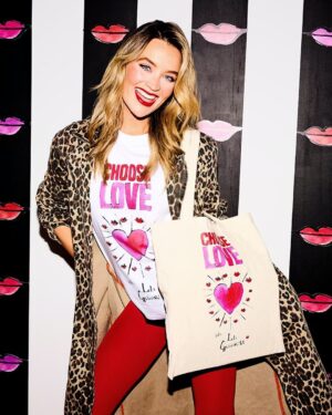 Laura Whitmore Instagram - We’re SO excited to show off this gorgeous collaboration with @lulu_guinness and @TheWhitmore 💖💖💖

For Valentine’s Day, Lulu Guinness chose love by supporting our work with refugees and displaced people all around the world.

Lulu Guinness has designed an iconic hand-drawn T-shirt and tote bag celebrating and spreading the Choose Love message. All proceeds from this very special T-shirt and tote bag, as well as 30% of proceeds from the ‘Lips’ clutch collection will be donated directly to our work, supporting those who need it most.

Huge thanks to the amazing Lulu Guinness team for their incredible generosity and stunning style, and our friend and long-term supporter, Laura Whitmore for fronting the campaign. 

Choose Love this February, and look great while doing it, by shopping the collection at the link in our bio.

Everything you buy makes a huge difference 💖