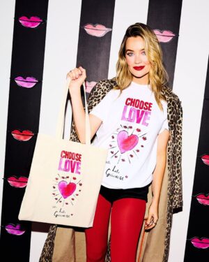 Laura Whitmore Instagram - We’re SO excited to show off this gorgeous collaboration with @lulu_guinness and @TheWhitmore 💖💖💖

For Valentine’s Day, Lulu Guinness chose love by supporting our work with refugees and displaced people all around the world.

Lulu Guinness has designed an iconic hand-drawn T-shirt and tote bag celebrating and spreading the Choose Love message. All proceeds from this very special T-shirt and tote bag, as well as 30% of proceeds from the ‘Lips’ clutch collection will be donated directly to our work, supporting those who need it most.

Huge thanks to the amazing Lulu Guinness team for their incredible generosity and stunning style, and our friend and long-term supporter, Laura Whitmore for fronting the campaign. 

Choose Love this February, and look great while doing it, by shopping the collection at the link in our bio.

Everything you buy makes a huge difference 💖