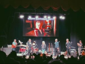 Lucinda Williams Instagram - A little late for a recap, but here we go… 

✨ 2024—what a year it’s been. It’s been a year of highs and lows, a year of music, memories, and profound loss. There were moments of joy, new takes on old songs shared, and memories made on stage with all of you. But there were also moments of heartache and grief, as we had to say goodbye to some amazing friends.
Through it all, I’ve been reminded of the power of music to heal, to connect, and to help us carry on. As I look back on the year, I’m filled with gratitude for the lessons, the love, and the strength I’ve found in both the beautiful and difficult moments.
As 2025 begins, I hold onto the hope that new songs, new stories, and new chapters are ahead. The road ahead might be uncertain, but one thing I know for sure: we’re in this together. Stay tuned for some exciting announcements we have to kick off this year.