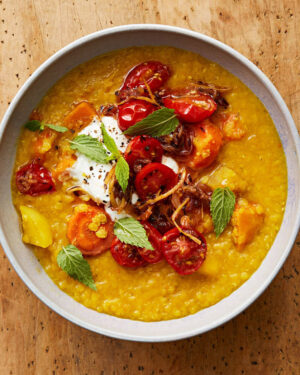 Martha Stewart Instagram - Here's a truly warming, soulful vegetarian dish to make for meatless Monday. This golden dal is packed with vegetables like carrots and orange bell peppers, turmeric adds to the glow, and a topping of cherry tomatoes sautéed with ginger finishes it all off. Serve with rice or naan. Get the recipe at the link in our bio. 📷: @sidneybensimon