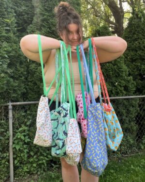 Meghan Tonjes Instagram - The @oopsiebagsie shop is OPEN! 
This summer I learned how to make tote bags and then proceeded to make a bunch of reversible totes with extra, extra, extra long straps. I love a tote but those short straps are uncomfortable for me to put my arms through (and maybe I wanna wear my big bag cross body!).

I thought about keeping all of these, but they’re up in the shop now. There’s also a 40% off sale for the rest of the shop. So, if you want to get a unique, handmade oopsiebag (perfect for toiletries, pens, makeup, to hold all of the bits and bobs you need in one place) now would be a good time to swoop.

Link the shop is in my stories   on the @oopsiebagsie instagram. 

☀️ 🏄 👛 🌻