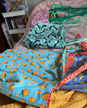 Meghan Tonjes Instagram - The @oopsiebagsie shop is OPEN! 
This summer I learned how to make tote bags and then proceeded to make a bunch of reversible totes with extra, extra, extra long straps. I love a tote but those short straps are uncomfortable for me to put my arms through (and maybe I wanna wear my big bag cross body!).

I thought about keeping all of these, but they’re up in the shop now. There’s also a 40% off sale for the rest of the shop. So, if you want to get a unique, handmade oopsiebag (perfect for toiletries, pens, makeup, to hold all of the bits and bobs you need in one place) now would be a good time to swoop.

Link the shop is in my stories   on the @oopsiebagsie instagram. 

☀️ 🏄 👛 🌻