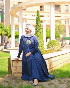 Moomal Khalid Instagram - Himma Sisters Khuwahish-e-Kanwal “Step into timeless elegance with this beautifully crafted dress in soft, flowing viscose. Featuring a round neckline and gathered sleeves, it exudes classic charm. A vibrant, hand-embroidered floral motif graces the front, set against deep blue fabric and accented by delicate pearls for added sophistication. The three-layered design, enhanced with joiner lace, creates a graceful, fluid silhouette ideal for any occasion.

Embrace the perfect blend of traditional craftsmanship and modern style with this exquisite dress by @himmasisters 

Picture credits @amanphotography42