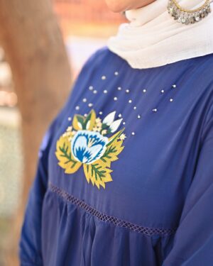 Moomal Khalid Instagram - Himma Sisters Khuwahish-e-Kanwal “Step into timeless elegance with this beautifully crafted dress in soft, flowing viscose. Featuring a round neckline and gathered sleeves, it exudes classic charm. A vibrant, hand-embroidered floral motif graces the front, set against deep blue fabric and accented by delicate pearls for added sophistication. The three-layered design, enhanced with joiner lace, creates a graceful, fluid silhouette ideal for any occasion.

Embrace the perfect blend of traditional craftsmanship and modern style with this exquisite dress by @himmasisters 

Picture credits @amanphotography42