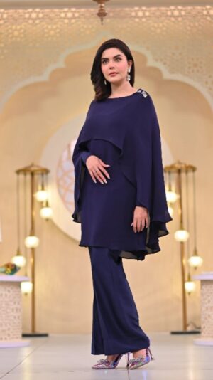 Nida Yasir Instagram - Navy blue pure georgette shirt with a unique cut and sworski on it paired with pure rawsilk 80grams blue bootcut pants.modern yet modest
@ynida.clothing