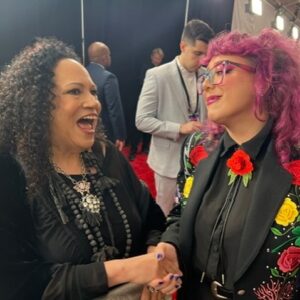 Rhiannon Giddens Instagram - I will be posting black history/excellence posts again for sure. Just wanted to report back on my little corner of the GRAMMYs, which happened yesterday.  I was nominated for Best American Roots Performance, for the recording of “The Ballad of Sally Anne”, a heartbreaking song about a lynching, which I recorded in Ireland with Francesco Turrisi and Ben Rawlins, and was finished by Ebonie Smith, for Fiona Prine’s Oh Boy Records. It was written by Alice Randall, who has been working in Nashville for over 40 years, writing anthems for black women while there weren’t many of us allowed into the establishment to sing them.  That was our win; the trophy itself went to someone else and that’s fine by me! There’s room for us all.

I took Alice as my date and we had a ball dropping nuggets of knowledge all down the red carpet, with my banjo in tow 🙂 (yes the 1858-replica banjo that graced the album of the year with its deep funky sounds... ) 

For me, being involved in this deeply cultural music is more than a career, it’s more than an album, it’s more than a single.  It’s a mission to show how beautiful Americans can actually be together; it’s proof that we are more alike than we are different, and it’s a study in how we do not need a hyphen; if anything, American history itself needs a hyphen.  We are America; America is us.  And the groundwork that the folks before us laid, like Linda Martell yes, but also Lil Hardin, and Libba Cotten, and Joe Thompson, and Ray Charles; and folks laying all the groundwork right NOW, like Rissi Palmer, and Dena Ross Jennings, and Angela Wellman, and so many others, educating and welcoming and doing all the active things you do to build real community.  It takes time; it takes humility; it takes interest in other people and other people’s success.

For me, saying their names, all of them, makes me feel grounded.  For me, acknowledging that I would not be here without them, makes me feel stronger.  The rising tide lifts all boats.