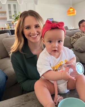 Sara Dietschy Instagram - I could write a caption as long as a book describing what happened the night you were born. The brutal week leading up to that day. The 2 months in the NICU. The moments of despair sitting in bed alone pumping without you in my tummy but also without you next to me. I had no idea what to expect. 

However — I’m making a conscious effort to leave a lot of the weight in 2024. The word we keep coming back to is GRATEFUL. Phewww. Grateful for your giggles. Grateful for your already amazing personality. Grateful for the snuggles we get every single day. Grateful for your daddy and our amazing supportive family that has always been there for us. Grateful for my amazing therapist! and also grateful for you guys online for always having kind words. Grateful for 1️⃣🎉🎂🥳🎈

Happy birthday baby girl. 

It is insaneeeee seeing NICU pictures of you now. In awe of your strength. I think we would have all preferred your original due date in April for MANY reasons but it was pretty cool to get snow on your bday🧡 A 27 2 QUEEENNNNN 💪