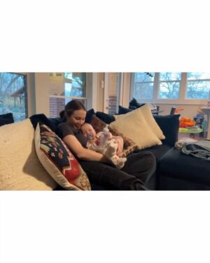 Sara Dietschy Instagram - I could write a caption as long as a book describing what happened the night you were born. The brutal week leading up to that day. The 2 months in the NICU. The moments of despair sitting in bed alone pumping without you in my tummy but also without you next to me. I had no idea what to expect. 

However — I’m making a conscious effort to leave a lot of the weight in 2024. The word we keep coming back to is GRATEFUL. Phewww. Grateful for your giggles. Grateful for your already amazing personality. Grateful for the snuggles we get every single day. Grateful for your daddy and our amazing supportive family that has always been there for us. Grateful for my amazing therapist! and also grateful for you guys online for always having kind words. Grateful for 1️⃣🎉🎂🥳🎈

Happy birthday baby girl. 

It is insaneeeee seeing NICU pictures of you now. In awe of your strength. I think we would have all preferred your original due date in April for MANY reasons but it was pretty cool to get snow on your bday🧡 A 27 2 QUEEENNNNN 💪