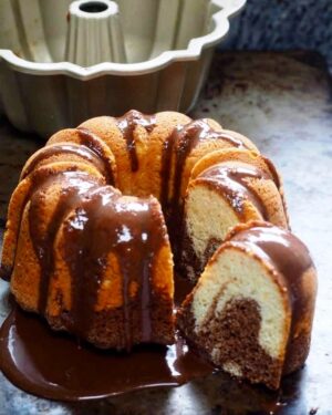 Silvia Colloca Instagram - Just my favourite tea cake, Marbled Ciambellone 
INGREDIENTS:

3 eggs

200 gr (1 cup) of caster sugar

250 gr (2 and 1/3 cups) of self-raising flour

2 tablespoons of corn starch

60 ml (1/4 cup) of grape seed oil (or lightly scented olive oil)

125 gr (1/2 cup) of Greek yogurt

1 teaspoon of vanilla extract

Melted chocolate for serving (optional)

How To

1. Whisk eggs and sugar until pale and creamy.

2. Add the oil , Greek youghurt and the vanilla

3. Gently fold in the flour and the corn starch, well sifted. Mix until the batter is combined.

4. Pour 2/3 of the mix into a ring-cake tin (I used a silicon one so I didn’t have to grease it.). 5. Add 3 tablespoons of bitter cocoa to the remaining cake batter and mix until smooth.

6. Dollop the cocoa mix on top of the vanilla mix and , using a fork or a chopstick, swirl the two batters together.

7. Bake in a preheated 170 C (340 F) oven for about 40/45 minutes, or until a skewer comes out clean. Let the cake cool in its tin for about one hour before serving, drizzled with melted chocolate, if liked.