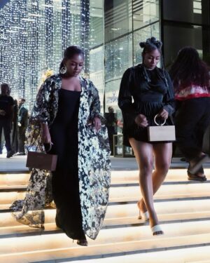 Somkele Iyamah Idhalama Instagram - It’s party season and my sister @somkele_i and I kicked it off in the best selling @andreaiyamah OWA bags which has finally restocked! ✨🥂 We’re Front row at the Future Face event wearing @andreaiyamah OWA BAG   LOLA EARRINGS   LENTI Dress   YURI HEELS 🖤 love how one bag Is chocolate and the other is caramel just like us! Which color would you pick?! I might just gift someone one of them 😉