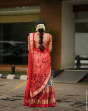Sruthy Suresh Instagram - ♥️Loved how this whole look came together ✨

Outfit : @bullion_knot ♥️
MUA : @sreez__makeover 😘
Clicks📸 : @storiesbysharonshyam 

#dhawani #redoutfit #red #keralawedding #keralatraditional #halfsaree #dhavani 

{ red Dhawani , traditional Dhawani set, red , Kerala, half saree, traditional outfit , Kerala wedding }