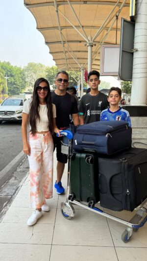 Tara Sharma Instagram - Hi everyone have a lovely day! 

Just on our way for a little #family trip any guesses where?. @roopaksaluja ✈️❤️🧿

Hints:
Not far 
Sunny 🌞 
Swimmy 🐟
Haven’t been there for a long time. 😬🏝️

Back for Diwali 🪔 (yep too much luggage for just 3 days, I’m not a great packer haaha! ) 

First 3 to guess right get a tag and shout out (if you want) in my next live.

Staying in a new place there that we haven’t been to before will update on that soon too but already impressed by the kind what’s app message they sent with our pick up details. Will reveal where soon.

PS if you watched the #thetarasharmashow trailer of season 1 I posted a few days ago, you will notice the huge diffference with our #kids being so big now (we are going into Season 6 and they don’t feature in it much now, they don’t allow it haaha) yes #teens and happy looking forward to the lil break but no yelping glee like when they were #babies haaha! 
All episodes on our YouTube channel link in bio. #vlog of this coming soon too! 

Onward and upward touch wood😀

#ootd @freakinsindia @zara #sneakers @pumaindia 
#football jerseys on kids 
Kids kindly complying to my few video requests for now, they may soon decide not to haaha, hence the immediate post.
#travelwithtara 
#taraandteens
#travelwithteens 
Thanks dear airport staff for taking this video, no camera person with us so asking people to take a few vids here and there is often the DIY way what say haaha and ofcourse in house help when they agree! 
A v Happy pre Diwali and Diwali week all!

#staysafe
