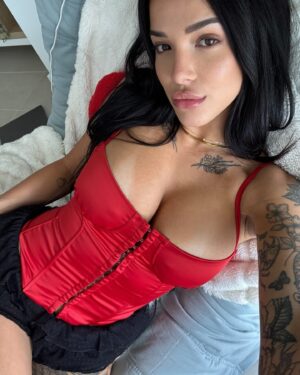 Valerie Bragg Instagram - Valentine’s Day is just around the corner ❤️💌🌹 @fashionnova 

Wearing Pure Seduction Satin Corset Top - Red
Cast Your Spell Ruffle Bloomer Short - Black