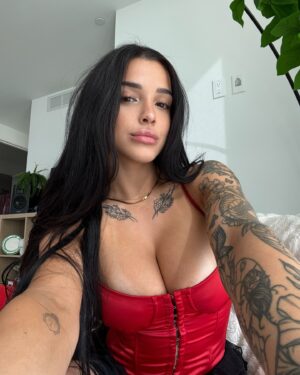 Valerie Bragg Instagram - Valentine’s Day is just around the corner ❤️💌🌹 @fashionnova 

Wearing Pure Seduction Satin Corset Top - Red
Cast Your Spell Ruffle Bloomer Short - Black