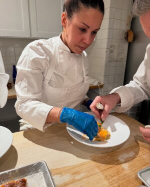 Adrienne Cheatham Instagram - Tuesday night was magical! (And made me miss being in restaurants 🥲) I’m so honored to have been a part of this event for the @jacquespepinfoundation and @beardfoundation sharing a kitchen with @lerouxeddy @danielboulud @chefgabrielkreuther @jacquestorres 

Our host @marvasmalls brought together an incredible group of people around the table that are all excellence personified and it was an honor to cook for them (during Black History Month no less). 
Sharing space with the chefs from all the teams, working collaboratively and seeing how much we all have in common was a joy. A special THANK YOU to @lana_cooks for coming straight from the airport to be there with me making sure things went smoothly, @jbfizabela for running the evening so well, and the great students from @iceculinary Abe, Nyaira, and Marven who came with open minds and good vibes to assist and soak up the experience. 

***For those of you who voted in the outfit poll, I went with Option 3 - the blue work jacket look for prep and set up, then did a costume change for service into Option 1 - the classic, crisp white jacket and apron! It felt right and was perfect for the situation. 

#chef #cheflife #jamesbeardhouse #blackhistorymonth
