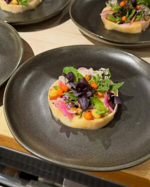 Adrienne Cheatham Instagram - Tuesday night was magical! (And made me miss being in restaurants 🥲) I’m so honored to have been a part of this event for the @jacquespepinfoundation and @beardfoundation sharing a kitchen with @lerouxeddy @danielboulud @chefgabrielkreuther @jacquestorres 

Our host @marvasmalls brought together an incredible group of people around the table that are all excellence personified and it was an honor to cook for them (during Black History Month no less). 
Sharing space with the chefs from all the teams, working collaboratively and seeing how much we all have in common was a joy. A special THANK YOU to @lana_cooks for coming straight from the airport to be there with me making sure things went smoothly, @jbfizabela for running the evening so well, and the great students from @iceculinary Abe, Nyaira, and Marven who came with open minds and good vibes to assist and soak up the experience. 

***For those of you who voted in the outfit poll, I went with Option 3 - the blue work jacket look for prep and set up, then did a costume change for service into Option 1 - the classic, crisp white jacket and apron! It felt right and was perfect for the situation. 

#chef #cheflife #jamesbeardhouse #blackhistorymonth