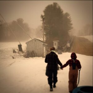 Amanda Palmer Instagram - Me and my child, hand in hand, trudging uphill. 

Very perfect for the changing of the New Year and what we all have ahead of us. 

Gorgeous photo taken by Brad Samuels, my noble and beautiful old friend from elementary school.