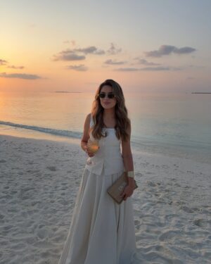 Chloe Lloyd Instagram - We woke up in our happy place - The Maldives🥹
We’ve been counting down the days to this trip for the last year! We adore it here SO much and just feel so lucky to even step foot on this beautiful place. It’s just so calming and how beautiful it is just can’t be captured in photographs! No cars, no pollution, just beautiful scenery, clear blue waters, thriving greenery and stunning wildlife. We’re doing two islands this year and are currently staying at Dhigali. 🤍
Island: @dhigalimaldives 
linen skirt & top: @aavelleofficial 
bag @diorbeauty @dior 
#maldives #maldives🌴