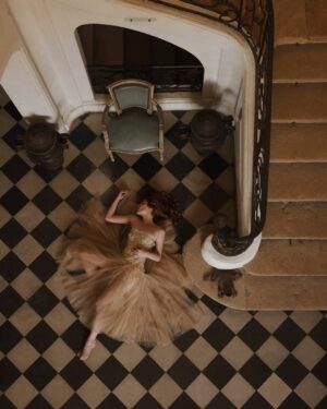 Courtney Halverson Instagram - Some days, I feel like a ballerina mid-spin; dizzy and weightless, uncertain if I’ll land gracefully or tumble. The world blurs at the edges, my eyes searching for something steady - but I think I must have forgotten to pick a point to hold on to. And everything tilts, the floor feels far - too far, and I’m not sure if I’m still dancing or just trying not to fall.

Maybe I need to remind myself that I’m still learning to find my own stillness in the whirling, to tell myself that every dancer must falter before they find their balance again. That grace does not come from never losing your footing, but in the way you pick yourself up after the fall.

Musings on feeling a bit off-balance as of late - something I know I’m not alone in. 🩰 | I’m calling this little series ‘a fallen ballerina’ featuring a dress from @montsand_official, as captured by @krystal_bick at Château Marcellus. 
.
.
.
#romanticstyle #feminineenergy #afallenballerina #movielike