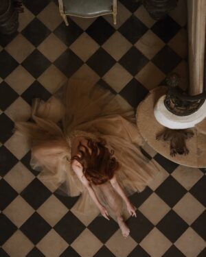 Courtney Halverson Instagram - Some days, I feel like a ballerina mid-spin; dizzy and weightless, uncertain if I’ll land gracefully or tumble. The world blurs at the edges, my eyes searching for something steady - but I think I must have forgotten to pick a point to hold on to. And everything tilts, the floor feels far - too far, and I’m not sure if I’m still dancing or just trying not to fall.

Maybe I need to remind myself that I’m still learning to find my own stillness in the whirling, to tell myself that every dancer must falter before they find their balance again. That grace does not come from never losing your footing, but in the way you pick yourself up after the fall.

Musings on feeling a bit off-balance as of late - something I know I’m not alone in. 🩰 | I’m calling this little series ‘a fallen ballerina’ featuring a dress from @montsand_official, as captured by @krystal_bick at Château Marcellus. 
.
.
.
#romanticstyle #feminineenergy #afallenballerina #movielike