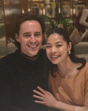 Eva Noblezada Instagram - I am texting this caption as a friggin Fiancé!!!!! 😭😭😭 
To my betrothed,
@reevecarney you are perfect and this past weekend in London was perfect!!!! I am so thankful our family was there because of you!! 😭❤️‍🔥🎉🫶🏽🥂♾️ To the grave and beyond my love!!!!! 🥹🥰🥰🥰🥰🥰🥰🥰 I love you!!! 🎉🥂✨♥️♥️♥️♥️
(Last pic taken by @fablesintheair 6 years ago 🥹) 
Love you familia so much!!! @mamasmurf5 @ianthearcher @zanecarney @poopmcgee @adrianafstan ♥️♥️