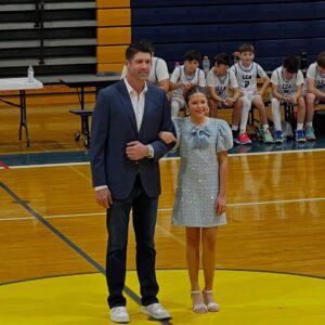 Jennie Finch Instagram - P was honored to represent her 6th grade class on Court. She was over the moon excited to walk with Casey, it was the sweetest! 🥰 She had a quick 4 min change from her basketball uni to her dress & heels. She’s a gamer! We couldn’t be more thankful for our village for their love & support always. 💙🤍 P wanted to play this song on the way to the game… May she always hold Psalm 23 in her heart. 🙏🏽