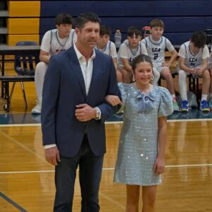 Jennie Finch Instagram - P was honored to represent her 6th grade class on Court. She was over the moon excited to walk with Casey, it was the sweetest! 🥰 She had a quick 4 min change from her basketball uni to her dress & heels. She’s a gamer! We couldn’t be more thankful for our village for their love & support always. 💙🤍 P wanted to play this song on the way to the game… May she always hold Psalm 23 in her heart. 🙏🏽