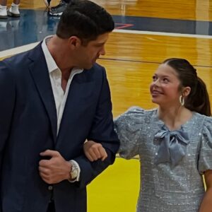 Jennie Finch Instagram - P was honored to represent her 6th grade class on Court. She was over the moon excited to walk with Casey, it was the sweetest! 🥰 She had a quick 4 min change from her basketball uni to her dress & heels. She’s a gamer! We couldn’t be more thankful for our village for their love & support always. 💙🤍 P wanted to play this song on the way to the game… May she always hold Psalm 23 in her heart. 🙏🏽