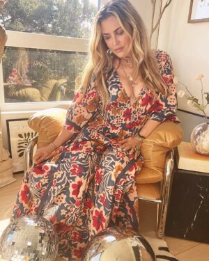 Jillian Warry Barberie Instagram - Modern comfort with a 70’s flair.

Dress: @freepeople 
Lipstick: @westmanatelier (Shade: Pique)
Chair: @cb2 
Disco balls: @amazon