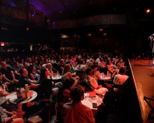 Joanna Hausmann Instagram - Sappy post warning: I accomplished a live long dream of performing at a Moth GrandSLAM and felt so honored to be able to share a story about Venezuela, my family’s experience with political repression, oh and, um, the fact I got attacked by a literal bull on a ranch when I was 10! What a ride! Thanks to @annaeroberts and @gabrielszajnert for making it possible and @iampetercooper for the pics. So so humbled to share the stage with such remarkable storytellers! PS: I was told I couldn’t touch or move the mic and I was like “um I’ve never stood still a second of my life” but I did it 🩷