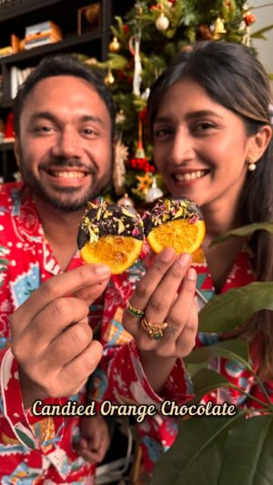 Larissa Dsa Instagram - This candied orange Chocolate anyone can make at home and it is going to be our favourite sweet this Christmas. Did you like our CHRISTMAS PJs (they're as soooo cute) which Larissa gifted me this Merry season. Will you try this Delishaaas recipe at home?
.
.
Candied Orange Chocolate 
.
2 Oranges, sliced 
Boil the oranges for 10 mins 
😂😂😂
1/4 cup Sugar 
1/4 cup Water 
1/2 inch Cinnamon stick 
Bring to a light simmer 
Add orange slices 
& boil for 12 mins 
Place onto a silicone lined tray 
& bake at 120 C 
till dried 
Look at that 😍
. 
Coat with some chocolate 
Garnish with pistachios & rose petals 
Delishaaas 🔥😍