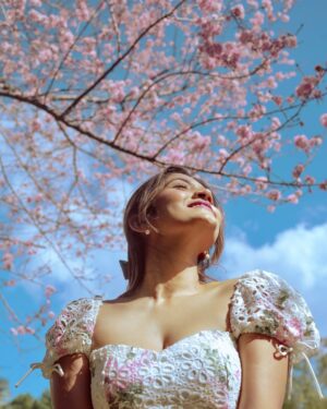 Larissa Dsa Instagram - Cherry Blossom in full bloom in 📍Shillong 🌸

I have been in Meghalaya for the past 10 days filming the next two episodes for @natgeoindia and I cannot wait for it to go live! 

Cant share too much on my stories or feed since it’s all a part of the project, so will share when the episodes come out 🥹🌸 

Thanks for the epic photos and company my gurlllsss @riddhibhattrb_ @ritika_jasmera 🥹🫶🏼🌸

Dress - @lovetrianglethelabel (got it from asos 4 years ago)
Jewels - @beyond.larissa (new collection 🥹coming soon)
Shoes - @cariuma
Pink Shrug - @fuss_pot 🌸