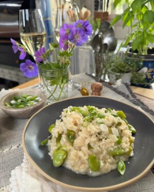Lidia Bastianich Instagram - Making a risotto is all about the technique, but, for me, the flavoring is all about capturing the tastes and aromas of the seasons, this Risotto with Asparagus and Favas sings Spring!  This week on Lidia's Kitchen we’re featuring recipes, like this one, from my latest book - "Lidia's From Our Family Table To Yours". It’s a personal collection of more than a hundred of our favorite family recipes.  Link to your local TV listings - and this recipe - in my bio.  Buon Gusto!  American Public Television . #LidiasRecipes #LidiasItaly #LidiasKitchen  #LidiaBastianich #ItalianFood #FromLidiasTableToYours #LidiaOliveOil @ampublictv