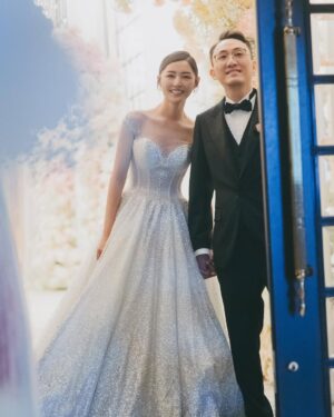 Michelle Wai Instagram - 唔經唔覺婚禮已經過咗兩星期，記得結婚當日，由起身一擘大眼嗰一刻開始，就好緊張同擔心。但係好幸運地一切都好圓滿，感激所有好朋友嘅幫忙，感激所有團隊高質素完美嘅配合，每一刻嘅畫面都充滿着愛同感動，雖然婚後對腳痛足三日，感覺好似拍咗三日打戲一樣，但都係值得嘅! ❤️

Hotel Venue: @islandshangrila
Hotel Deco: @bigdayweddingg 
Photography: @billyonairphotography
Emcee: @kissisis
Gowns: @trinitybridal #trinitybridal
High Heels: Silver ones/@giuseppezanotti, White ones/@christianlouboutin
Jewellery: @emperorjewellery 
Suit: @decon.tailormade 
Michelle&Kenley’s makeup: @make_up_by_mw 
Michelle&Kenley’s Hairstyling: @singsing113 
Bouquet: @bfflowers.boule.de.fleurs
Wedding Favors: @jomalonelondon @skinceuticals @lucullus_hk @shwedding.store