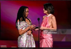 Natalie Morales Instagram - I love the @filmindependent Spirit Awards, it’s the funnest, and getting to see and support all of my fellow indie filmmakers is always the best. @therealsonequa and I were so honored to present @jomofray with the award for Best Cinematography for @nickelboysmovie ! Second to last photo is Sonequa desperately whispering to me under her breath “ CAN I OPEN ITTTTTTT” 

Have i mentioned how much i absolutely love @therealsonequa ? 

Styling by @kimmyerin 
Hmu by @nicoincognito 
Dress @silviatcherassi 
Jewelry @sterlingforever