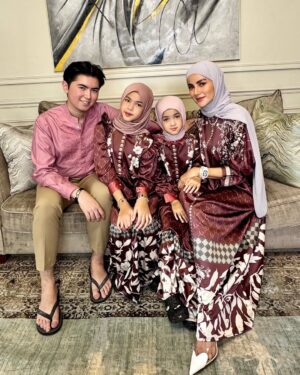 Olla Ramlan Instagram - “Children do not ask to be born into this world, yet they arrive full of wonder, hope, and endless possibilities. It is within the warmth of family that they learn their worth, their dreams take flight, and their hearts find their first understanding of love.”

Our Dress - @vivizubedi @mrsvivi 

Happy Eid al-Fitr! 🔥